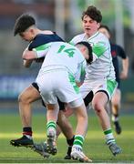 4 February 2025; Mark Garry of Wesley College is tackled by Gonzaga College players Evan Doyle, left, and Oscar Sugrue-Lynch during the Bank of Ireland Leinster Rugby Boys Schools Junior Cup First Round match between Wesley College and Gonzaga College at Energia Park in Dublin. Photo by Shauna Clinton/Sportsfile