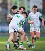 4 February 2025; Mark Garry of Wesley College is tackled by Gonzaga College players Evan Doyle, left, and Oscar Sugrue-Lynch during the Bank of Ireland Leinster Rugby Boys Schools Junior Cup First Round match between Wesley College and Gonzaga College at Energia Park in Dublin. Photo by Shauna Clinton/Sportsfile