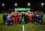 7 February 2025; Shelbourne players and staff celebrate with the FAI President's Cup in the company of President of Ireland Michael D Higgins and FAI President Paul Cooke after the 2025 Men's FAI President's Cup final match between Shelbourne and Drogheda United at Tolka Park in Dublin. Photo by Stephen McCarthy/Sportsfile