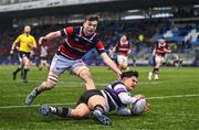 11 February 2025; Ethan Balamash of Terenure College dives over to score his side's first try despite the attention of Louis L'Estrange of Wesley College during the Bank of Ireland Leinster Rugby Boys Schools Senior Cup second round match between Wesley College and Terenure College at Energia Park in Dublin. Photo by Tyler Miller/Sportsfile