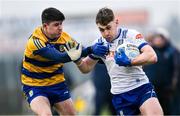 16 February 2025; Mícheál Bannigan of Monaghan in action against Niall Higgins of Roscommon during the Allianz Football League Division 2 match between Roscommon and Monaghan at King & Mofatt Dr Hyde Park in Roscommon. Photo by Stephen Marken/Sportsfile