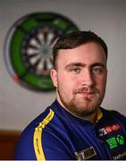 19 February 2025; Luke Littler poses for a portrait during a D7 Darts Youth Academy visit at Naomh Fíonnbarra GAA Club in Cabra, Dublin. Photo by Piaras Ó Mídheach/Sportsfile