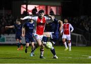 3 March 2025; Aidan Keena of St Patrick's Athletic is fouled by Adam O'Reilly of Derry City resulting in St Patrick's Athletic being awarded a second penalty during the SSE Airtricity Men's Premier Division match between St Patrick's Athletic and Derry City at Richmond Park in Dublin Photo by Stephen McCarthy/Sportsfile