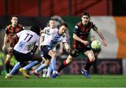 3 March 2025; Dawson Devoy of Bohemians in action against Drogheda United players Thomas Oluwa, 11, and Darragh Markey during the SSE Airtricity Men's Premier Division match between Bohemians and Drogheda United at Dalymount Park in Dublin. Photo by Thomas Flinkow/Sportsfile