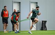 4 March 2025; Robbie Henshaw with head of athletic performance Aled Walters during an Ireland Rugby squad training session at the IRFU High Performance Centre in Dublin. Photo by Brendan Moran/Sportsfile