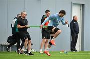 4 March 2025; Caelan Doris with physiotherapist Peter Scullion during an Ireland Rugby squad training session at the IRFU High Performance Centre in Dublin. Photo by Brendan Moran/Sportsfile