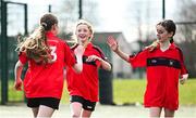 5 March 2025; Feena Nic Amhlaoibh of St Fintans, left, celebrates with teammates after scoring her side's first goal during the FAI Schools Primary 5s Qualifiers match between St Patricks Senior Mixed School and St Fintans at Hartstown Huntstown FC in Blanchardstown, Dublin. Photo by Seb Daly/Sportsfile