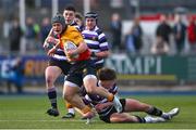 4 March 2025; Tadg Young of St Fintan's High School is tackled by Gareth Morgan of Terenure College during the Bank of Ireland Leinster Schools Senior Cup semi-final match between St Fintan's High School and Terenure College at Energia Park in Dublin. Photo by Shauna Clinton/Sportsfile