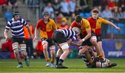 4 March 2025; Michael Bolger of St Fintan's High School is tackled by Terenure College players Frank Maher, left, and Luke McNiff during the Bank of Ireland Leinster Schools Senior Cup semi-final match between St Fintan's High School and Terenure College at Energia Park in Dublin. Photo by Shauna Clinton/Sportsfile