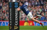 8 March 2025; Damian Penaud of France celebrates as he dives over to score his side's fifth try during the Guinness Six Nations Rugby Championship match between Ireland and France at the Aviva Stadium in Dublin. Photo by Seb Daly/Sportsfile