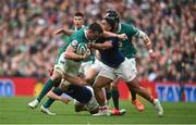 8 March 2025; Jack Conan of Ireland is tackled by Louis Bielle-Biarrey, left, and Peato Mauvaka of France during the Guinness Six Nations Rugby Championship match between Ireland and France at the Aviva Stadium in Dublin. Photo by David Fitzgerald/Sportsfile