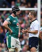 8 March 2025; Ireland captain Caelan Doris in conversation with referee Angus Gardner during the Guinness Six Nations Rugby Championship match between Ireland and France at the Aviva Stadium in Dublin. Photo by Seb Daly/Sportsfile