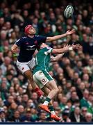 8 March 2025; Louis Bielle-Biarrey of France and Calvin Nash of Ireland contest a high ball during the Guinness Six Nations Rugby Championship match between Ireland and France at the Aviva Stadium in Dublin. Photo by Seb Daly/Sportsfile