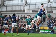 8 March 2025; Damian Penaud of France and Jamie Osborne of Ireland contest a high ball  during the Guinness Six Nations Rugby Championship match between Ireland and France at the Aviva Stadium in Dublin. Photo by Brendan Moran/Sportsfile Photo by Brendan Moran/Sportsfile