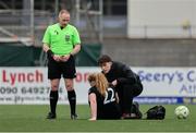 8 March 2025; Referee Jason Moore watches on as athletic therapist Ryan Cahill tends to the injured Ciara O'Neill of Athlone Town during the SSE Airtricity Women's Premier Division match between Athlone Town and Wexford at Athlone Town Stadium in Westmeath. Photo by Thomas Flinkow/Sportsfile *