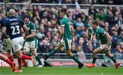 8 March 2025; Sam Prendergast of Ireland chips through, followed by teammate Jack Crowley, right, during the Guinness Six Nations Rugby Championship match between Ireland and France at the Aviva Stadium in Dublin. Photo by Brendan Moran/Sportsfile Photo by Brendan Moran/Sportsfile