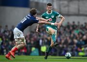 8 March 2025; Sam Prendergast of Ireland kicks past Oscar Jego of France during the Guinness Six Nations Rugby Championship match between Ireland and France at the Aviva Stadium in Dublin. Photo by Brendan Moran/Sportsfile Photo by Brendan Moran/Sportsfile