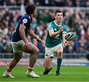 8 March 2025; Sam Prendergast of Ireland in action against Yoram Moefana of France during the Guinness Six Nations Rugby Championship match between Ireland and France at the Aviva Stadium in Dublin. Photo by Brendan Moran/Sportsfile Photo by Brendan Moran/Sportsfile