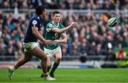 8 March 2025; Sam Prendergast of Ireland in action against Yoram Moefana of France during the Guinness Six Nations Rugby Championship match between Ireland and France at the Aviva Stadium in Dublin. Photo by Brendan Moran/Sportsfile Photo by Brendan Moran/Sportsfile