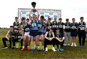 8 March 2025; First place finishers St Colmans Newry celebrate with the cup alongside second place finishers St Columbas Stranorlar and third place finishers Belverdere College after the Intermediate Boys 5,000m team event during the 123.ie All Ireland Schools Cross Country Championships at Galway Racecourse in Ballybrit, Galway. Photo by Tom Beary/Sportsfile