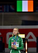 9 March 2025; Sarah Healy of Ireland with her gold medal while listening to her national anthem after winning the women's 3000m final on day four of the European Athletics Indoor Championships 2025 at the Omnisport Apeldoorn in Apeldoorn, Netherlands. Photo by Sam Barnes/Sportsfile