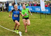 8 March 2025;  Olivia McCusker of Our Lady & St Pats Knock left, and Alaoise Nic Oireachtaigh of Gaelcholáiste na Mara compete in the Intermediate Girls 3,500m during the 123.ie All Ireland Schools Cross Country Championships at Galway Racecourse in Ballybrit, Galway. Photo by Tom Beary/Sportsfile