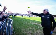 9 March 2025; Cork doctor Con Murphy gives a sliotar to Cork children before the Allianz Hurling League Division 1A match between Clare and Cork at Zimmer Biomet Páirc Chíosóg in Ennis, Clare. Photo by Piaras Ó Mídheach/Sportsfile