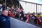 9 March 2025; Young Cork supporters cheer Cork manager Pat Ryan makes his way from the dressing room to the pitch before the Allianz Hurling League Division 1A match between Clare and Cork at Zimmer Biomet Páirc Chíosóg in Ennis, Clare. Photo by Piaras Ó Mídheach/Sportsfile