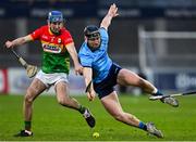 8 March 2025; Ciaran Whelan of Carlow in action against Ronan Hayes of Dublin during the Allianz Hurling League Division 1B match between Dublin and Carlow at Parnell Park in Dublin. Photo by Stephen Marken/Sportsfile