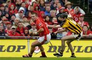 12 September 2004; Diarmuid O'Sullivan, Cork, in action against Martin Comerford, Kilkenny. Guinness All-Ireland Senior Hurling Championship Final, Cork v Kilkenny, Croke Park, Dublin. Picture credit; Brendan Moran / SPORTSFILE *** Local Caption *** Any photograph taken by SPORTSFILE during, or in connection with, the 2004 Guinness All-Ireland Hurling Final which displays GAA logos or contains an image or part of an image of any GAA intellectual property, or, which contains images of a GAA player/players in their playing uniforms, may only be used for editorial and non-advertising purposes.  Use of photographs for advertising, as posters or for purchase separately is strictly prohibited unless prior written approval has been obtained from the Gaelic Athletic Association.