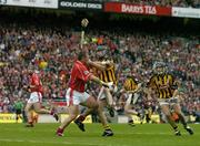 12 September 2004; Diarmuid O'Sullivan, Cork, in action against John Hoyne, Kilkenny. Guinness All-Ireland Senior Hurling Championship Final, Cork v Kilkenny, Croke Park, Dublin. Picture credit; Brendan Moran / SPORTSFILE *** Local Caption *** Any photograph taken by SPORTSFILE during, or in connection with, the 2004 Guinness All-Ireland Hurling Final which displays GAA logos or contains an image or part of an image of any GAA intellectual property, or, which contains images of a GAA player/players in their playing uniforms, may only be used for editorial and non-advertising purposes.  Use of photographs for advertising, as posters or for purchase separately is strictly prohibited unless prior written approval has been obtained from the Gaelic Athletic Association.