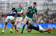 8 March 2025; Sam Prendergast of Ireland is tackled by Romain Ntamack of France during the Guinness Six Nations Rugby Championship match between Ireland and France at the Aviva Stadium in Dublin. Photo by David Fitzgerald/Sportsfile