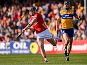 9 March 2025; Darragh Fitzgibbon of Cork shoots as Cathal Malone of Clare closes in during the Allianz Hurling League Division 1A match between Clare and Cork at Zimmer Biomet Páirc Chíosóg in Ennis, Clare. Photo by Piaras Ó Mídheach/Sportsfile