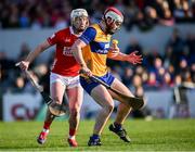 9 March 2025; Conor Leen of Clare in action against Patrick Horgan of Cork during the Allianz Hurling League Division 1A match between Clare and Cork at Zimmer Biomet Páirc Chíosóg in Ennis, Clare. Photo by Piaras Ó Mídheach/Sportsfile