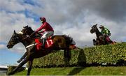 12 March 2025; Mister Coffey, with Nico de Boinville up, jumps the last alongside race-winner Stumptown, with Keith Donoghue up, during The Glenfarclas Cross Country Steeple Chase on day two of the Cheltenham Racing Festival at Prestbury Park in Cheltenham, England. Photo by David Fitzgerald/Sportsfile