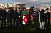 12 March 2025; Jockey Keith Donoghue, centre, celebrates with Winning Connections, including owners Colin and Ger Teahon, after winning The Glenfarclas Cross Country Steeple Chase with Stumptown on day two of the Cheltenham Racing Festival at Prestbury Park in Cheltenham, England. Photo by Harry Murphy/Sportsfile