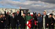 12 March 2025; Jockey Keith Donoghue, centre, celebrates with Winning Connections, including owners Colin and Ger Teahon, after winning The Glenfarclas Cross Country Steeple Chase with Stumptown on day two of the Cheltenham Racing Festival at Prestbury Park in Cheltenham, England. Photo by Harry Murphy/Sportsfile