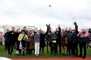 12 March 2025; Jockey Sean Flanagan, celebrates with Winning Connections, including trainer and owner Barry Connell, after winning The BetMGM Queen Mother Champion Steeple Chase with Marine Nationale on day two of the Cheltenham Racing Festival at Prestbury Park in Cheltenham, England. Photo by David Fitzgerald/Sportsfile