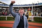 12 March 2025; Winning trainer Cian Collins celebrates after winning The Debenhams Johnny Henderson Grand Annual Handicap Steeple Chase Challenge Cup with Jazzy Matty on day two of the Cheltenham Racing Festival at Prestbury Park in Cheltenham, England. Photo by David Fitzgerald/Sportsfile