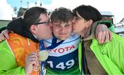 12 March 2025; Caolan McConville of Team Ireland, a member of Skiability Northern Ireland, Aghaghallon, Antrim,  with his Gold Medal, a first ever Gold for a Special Olympics Ireland athlete at Advanced level, is contratulated by his mother, Edel and dad Pearar, on day four of the Turin 2025 Special Olympics World Winter Games in Sestriere, Italy. Photo by Ray McManus/Sportsfile