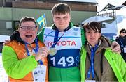 12 March 2025; Caolan McConville of Team Ireland, a member of Skiability Northern Ireland, Aghaghallon, Antrim,  with his Gold Medal, a first ever Gold for a Special Olympics Ireland athlete at Advanced level, is contratulated by his mother, Edel and dad Pearar, on day four of the Turin 2025 Special Olympics World Winter Games in Sestriere, Italy. Photo by Ray McManus/Sportsfile