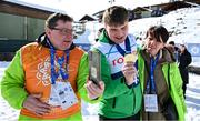 12 March 2025; Caolan McConville of Team Ireland, a member of Skiability Northern Ireland, Aghaghallon, Antrim,  with his Gold Medal, a first ever Gold for a Special Olympics Ireland athlete at Advanced level, is contratulated by his mother, Edel and dad Pearar, on day four of the Turin 2025 Special Olympics World Winter Games in Sestriere, Italy. Photo by Ray McManus/Sportsfile