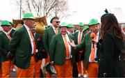 13 March 2025; Racegoers wearing Irish suits are interviewed prior to racing on day three of the Cheltenham Racing Festival at Prestbury Park in Cheltenham, England. Photo by Harry Murphy/Sportsfile