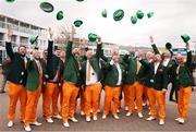 13 March 2025; Racegoers wearing Irish suits throw their hats in the air prior to racing on day three of the Cheltenham Racing Festival at Prestbury Park in Cheltenham, England. Photo by Harry Murphy/Sportsfile