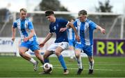 12 March 2025; Peter Walsh of Blackrock College in action against Alex Halpin and Jack O'Malley of Rice College during the FAI Schools Dr Tony O'Neill Senior National Cup final match between Blackrock College and Rice College at Athlone Town Stadium in Athlone, Westmeath. Photo by Matt Browne/Sportsfile