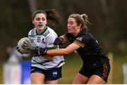 13 March 2025; Neesha Whelan of University of Limerick is tackled by Kacey Wright of TUS Midwest during the 2025 AIG Lagan Cup final match between TUS Midwest and University of Limerick at Queen's Sport in Belfast. Photo by Shauna Clinton/Sportsfile