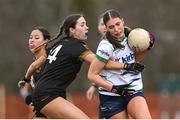 13 March 2025; Ava Burke of University of Limerick is tackled by Niamh Mahon of TUS Midwest during the 2025 AIG Lagan Cup final match between TUS Midwest and University of Limerick at Queen's Sport in Belfast. Photo by Shauna Clinton/Sportsfile