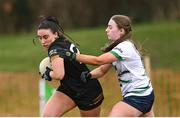 13 March 2025; Annakate Cournane of TUS Midwest is tackled by Mary Moore of University of Limerick during the 2025 AIG Lagan Cup final match between TUS Midwest and University of Limerick at Queen's Sport in Belfast. Photo by Shauna Clinton/Sportsfile