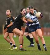 13 March 2025; Ava Burke of University of Limerick is tackled by Niamh Mahon of TUS Midwest during the 2025 AIG Lagan Cup final match between TUS Midwest and University of Limerick at Queen's Sport in Belfast. Photo by Shauna Clinton/Sportsfile