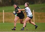 13 March 2025; Annakate Cournane of TUS Midwest is tackled by Mary Moore of University of Limerick during the 2025 AIG Lagan Cup final match between TUS Midwest and University of Limerick at Queen's Sport in Belfast. Photo by Shauna Clinton/Sportsfile